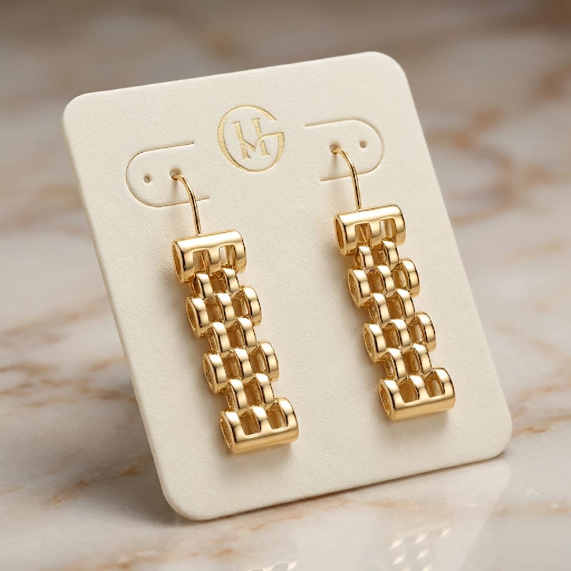 Long gold earrings featuring movable charms that sway with your movement, creating a captivating sparkle. A luxurious and modern piece that will turn heads. - Image 5